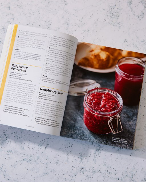 Cold Canning book open to page that displays recipes on the left and pickled food on the right