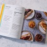 Cold Canning book open to page that displays recipes on the left and food photographs on the right