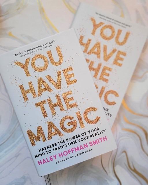 Photo of two copies of You Have the Magic laid above a white and gold marble backdrop